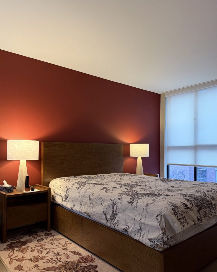 Cozy bedroom with warm lighting and modern decor.