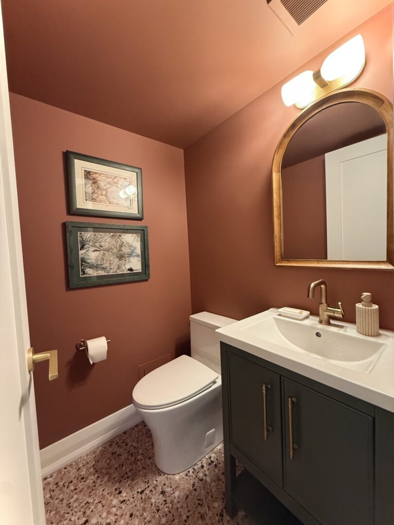Cozy bathroom with warm brown walls and modern fixtures.